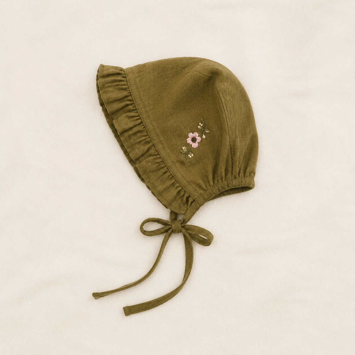 Olive Florence baby bonnet with floral embroidery and ruffle trim